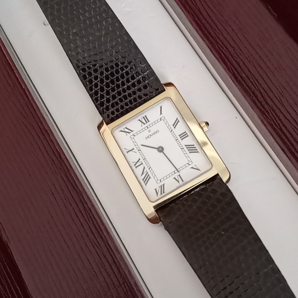 14 karat gold very unique Movado tank watch, genuine lizard strap